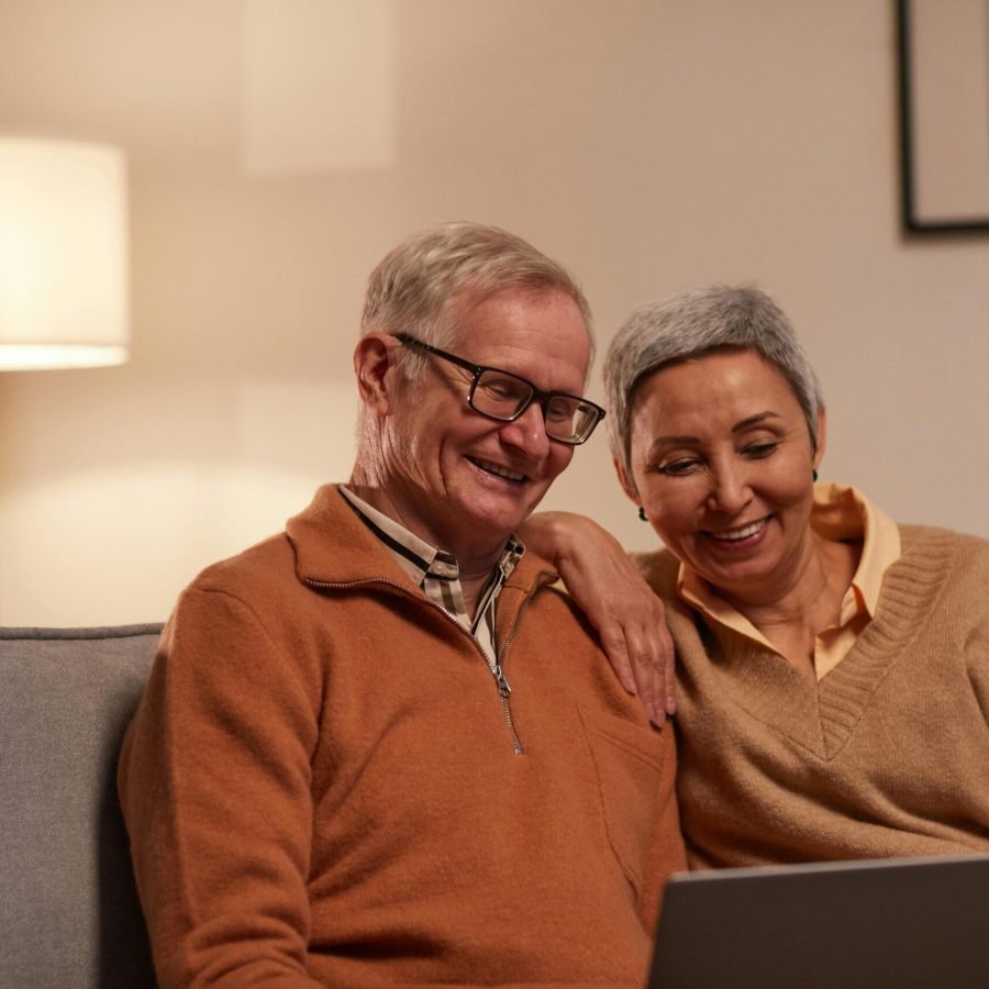 pexels-photo-6787970-6787970 Senior couple enjoying time together on laptop indoors, smiling and relaxed.